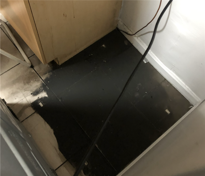 Soot under fridge